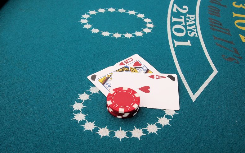 Ace and Queen on Blackjack Table