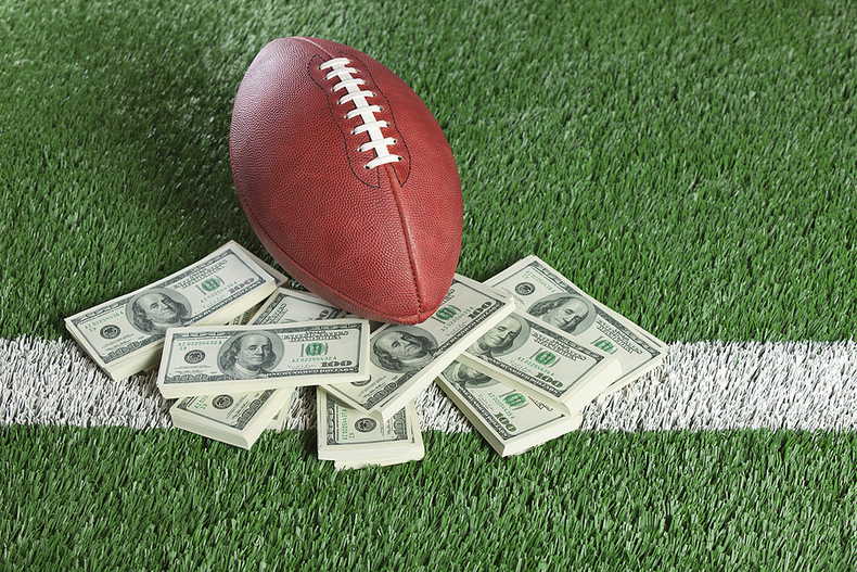 American Football with Piles on Money
