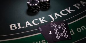 Blackjack Table with Black Cards and Chips