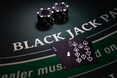 Blackjack Table with Black Cards and Chips
