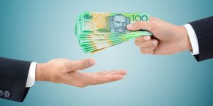 Businessman Passing Australian 100 Dollar Bills