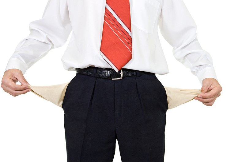 Businessman with Red Tie and Empty Pockets