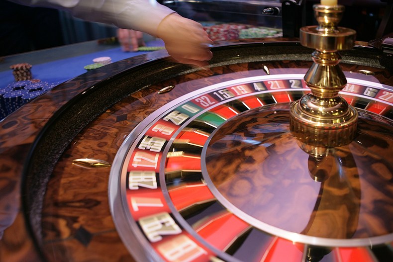 Dealer Spinning Roulette Wheel