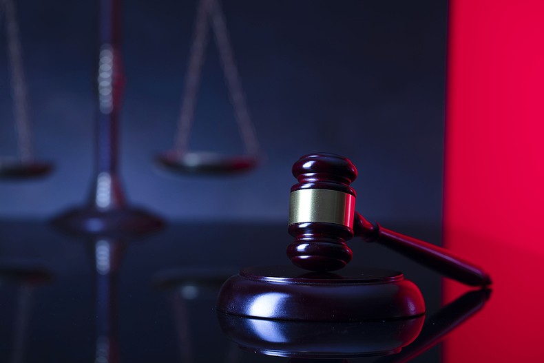 Gavel Against Blurred Scales