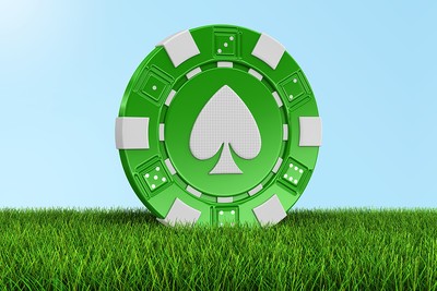 Green Casino Chip on Grass