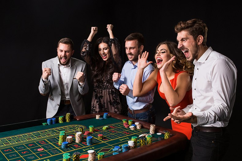 Group of Friends Celebrating at Roulette Table