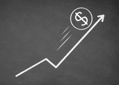 Growth Arrow with Dollar Sign on Chalkboard