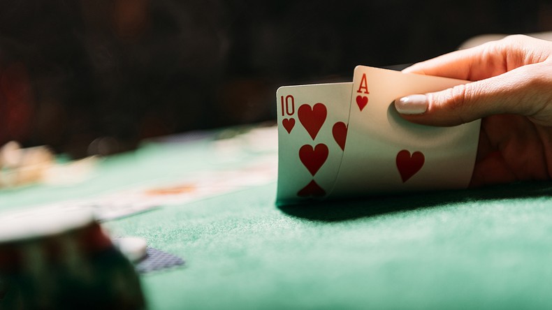 Hand of Woman Playing Poker
