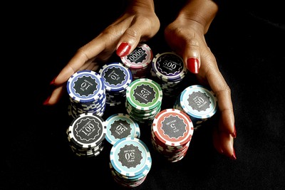 Hands of Female Poker Player with Chips