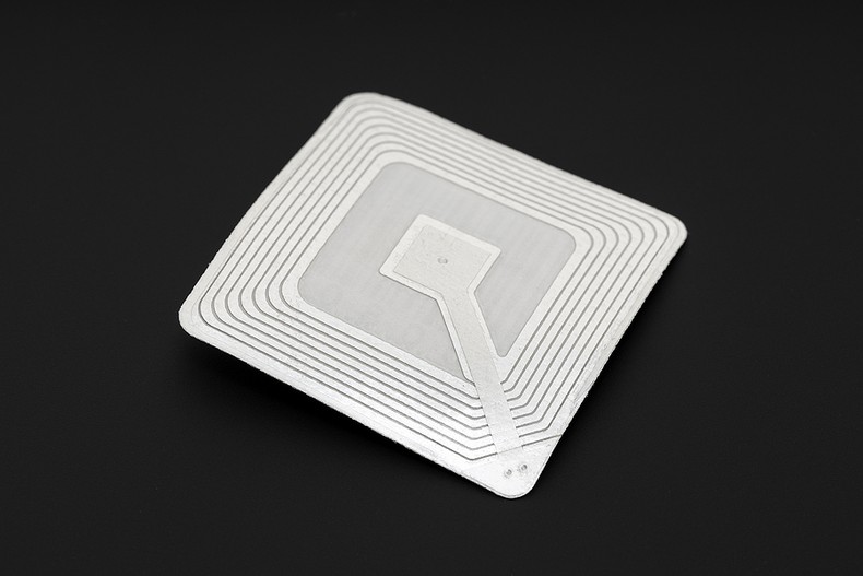 Isolated RFID Tag Against Black Background