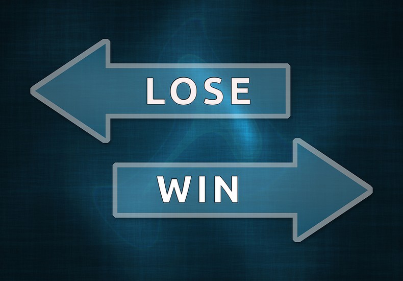 Lose and Win Arrows in Opposite Directions