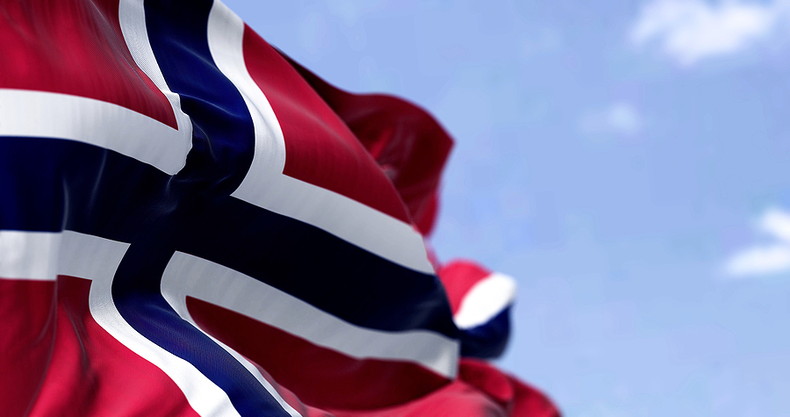 Norway Flag Waving Against Blue Sky