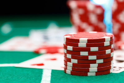 Red Casino Chips on Poker Table