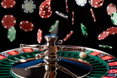Roulette Wheel with Falling Casino Chips