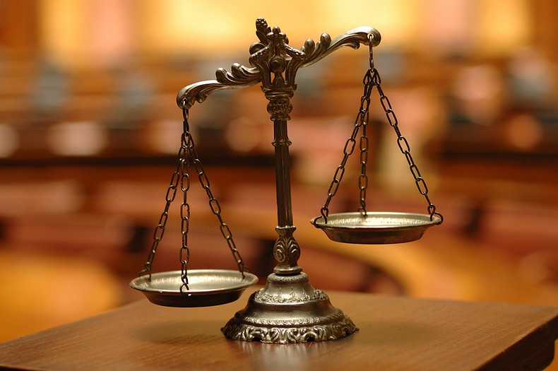 Scales of Justice in Courtroom