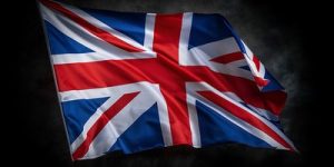 UK Flag Waving Against Dark Background