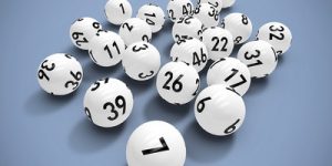 White Lottery Balls Against Grey Background