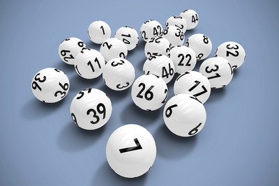 White Lottery Balls Against Grey Background